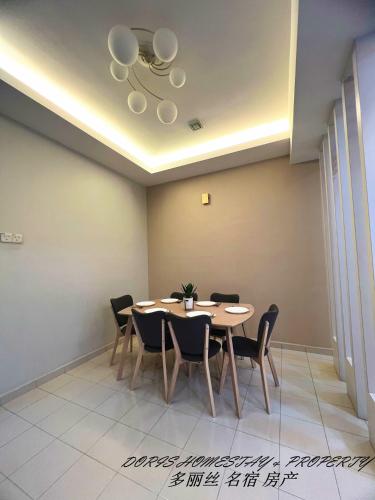 a dining room with a table and chairs at 10pax -2 Storey House Bayu Mutiara at Bukit Mertajam in Bukit Mertajam