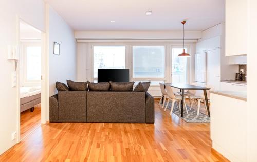 a living room with a couch and a table at Sauna and the City in Rovaniemi