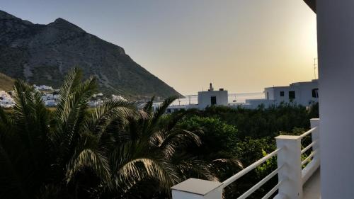 a view from the balcony of a house with a mountain at Oasis in Kamarai