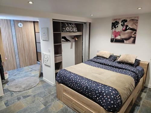 a bedroom with a large bed in a room at Loft 6 couchages (4+2) in Cauterets