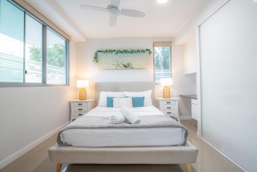 A bed or beds in a room at Nova Apartments 104 Mooloolaba Beach