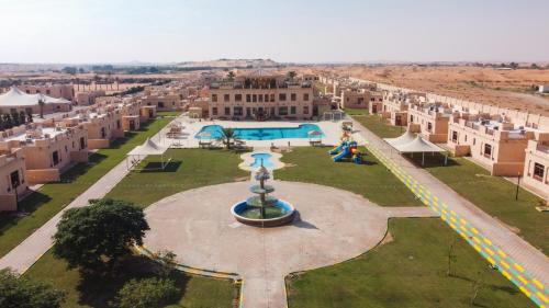 an aerial view of a courtyard with a fountain at Al Bada Hotel and Resort in Al Ain