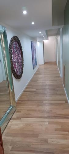 a hallway of an art gallery with wood floors at Como 3 B&B in Como