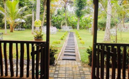 a view of a garden from a porch at Miracle Sand Country Resort in Mawatagama