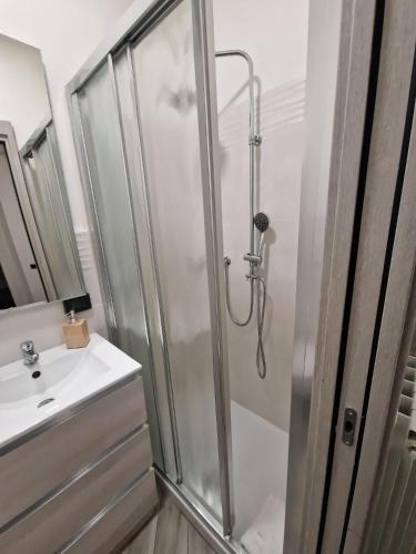 a bathroom with a shower and a sink at Pigneto Square Home in Rome