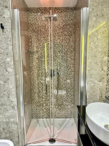a bathroom with a shower and a sink at Vatican Relais Rome in Rome