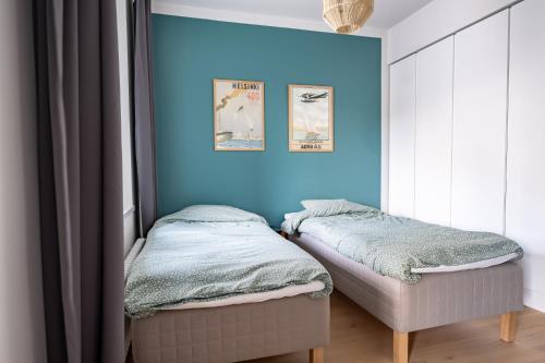 A bed or beds in a room at A new apartment in Helsinki