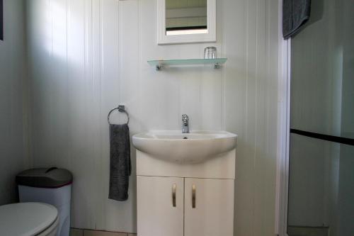 a bathroom with a sink and a toilet at SleepOver Upington in Upington