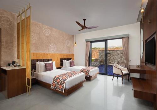 En eller flere senge i et værelse på Bookmark Resorts, Jogi Mahal, Ranthambore