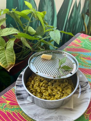 a strainer sitting on top of a bowl of pasta at Gadea Boutique Hotel& Gadea Garden Italian Restaurant in Jambiani