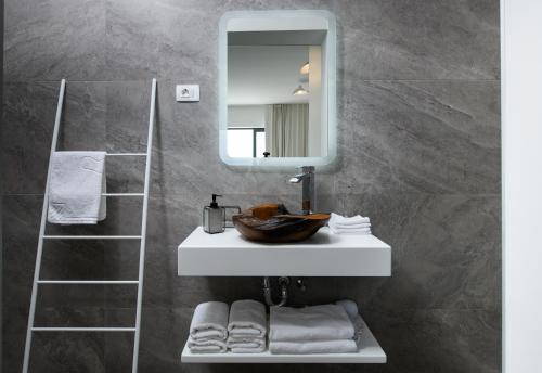 a bathroom with a sink and a mirror at Gallery Luxury Suites & Rooms-Only Adults in Split