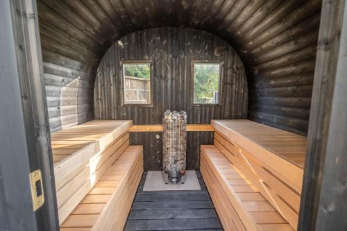 an inside view of a sauna with wooden walls at Kokořín Apartments in Kokořín