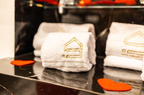 a group of towels on a table with red hearts at SUITE SPACE by concept italy in Casoria