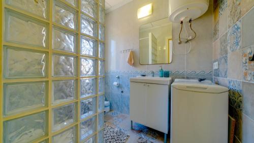 a bathroom with a toilet and a sink and a mirror at Estudio SOL en Alicante in Alicante