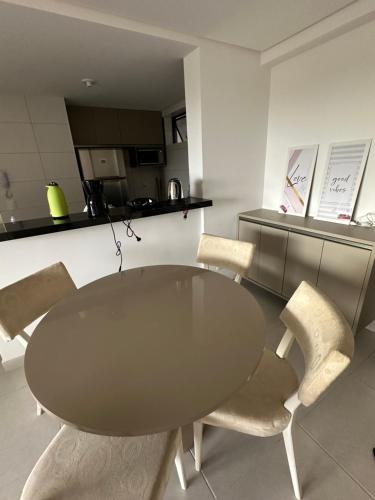 a dining room with a table and chairs at Blue Beach Beira Mar in Cabedelo