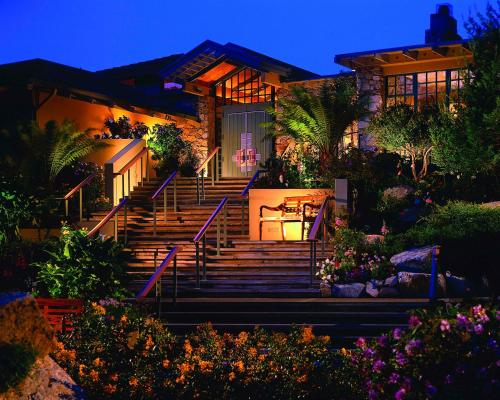a house with stairs in front of it at night at Hyatt Carmel Highlands in Carmel