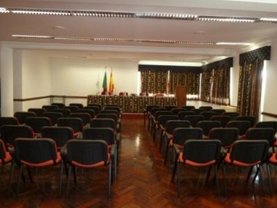 a large room with chairs and a room with at Hotel Brasa in Elvas