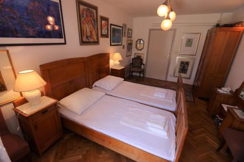 a bedroom with a large bed with white sheets at Holiday home in Silo/Insel Krk 26681 in Šilo