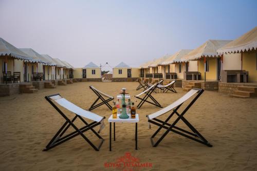 a group of chairs and a table on the beach at Royal Jaisalmer Resort with Swimming Pool in Jaisalmer