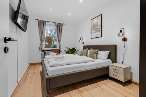 Säng eller sängar i ett rum på Frisch renovierte Wohnung - Zentral/Ruhig/Modern