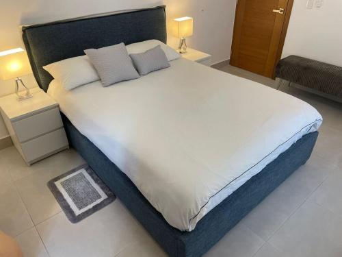 Postel nebo postele na pokoji v ubytování Apto comodo en Naco RP