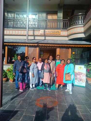 a group of people standing in front of a building at Paradise Boutique Hotel in Pokhara