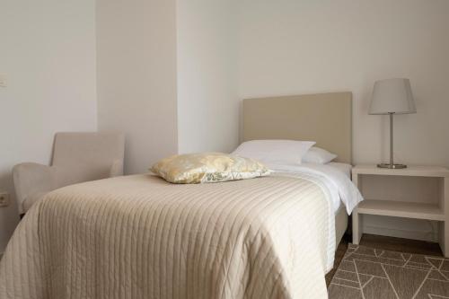 Postel nebo postele na pokoji v ubytování Hotel Magdalena