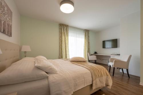 Postel nebo postele na pokoji v ubytování Hotel Magdalena