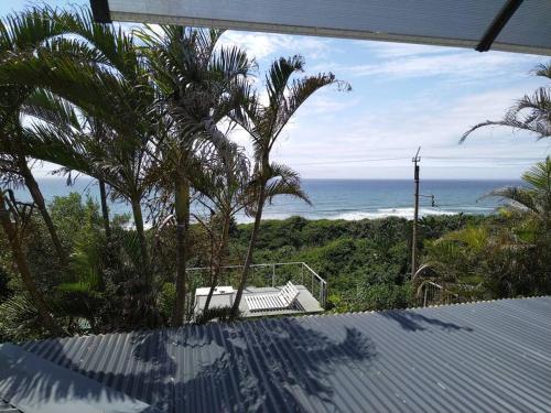 a view of the ocean from a house at Sunrise beach house in Kingsburgh