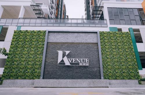 a building with a sign on the side of it at K AVENUE TOWER B by The Pillow House, 5 Minutes to KKIA Airport in Penampang