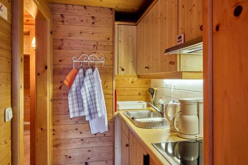 a kitchen with a sink and a counter top at Chalet Rüfikopf in Lech am Arlberg