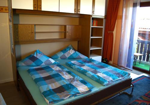 Un pat sau paturi într-o cameră la Wanderglück