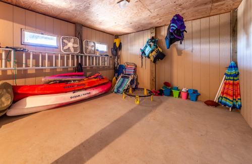 a room with a boat and other items in it at Ocean Aire in Knotts Island