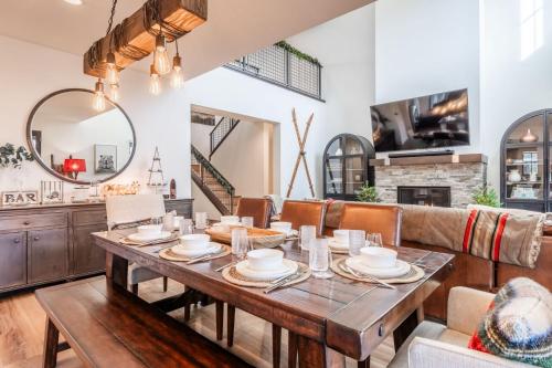 a dining room with a table and a couch at Creekhouse 1364 in Mammoth Lakes