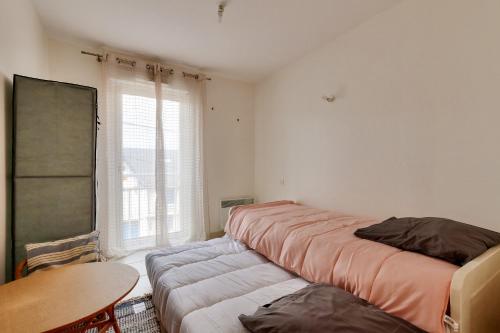 Ένα ή περισσότερα κρεβάτια σε δωμάτιο στο Sables d'Olonne - 450m de la plage