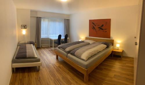 Postel nebo postele na pokoji v ubytování Quellenhof C01
