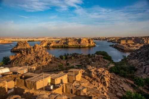 an aerial view of a village on the banks of a river at Eco Nubia in Aswan