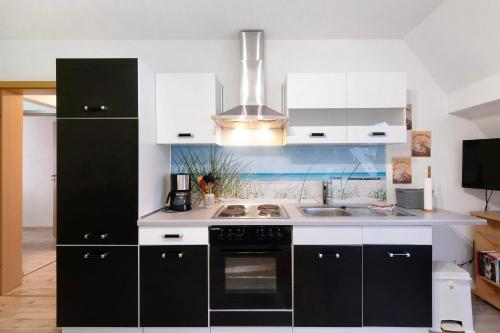 Dapur atau dapur kecil di Wuddisferienwohnug