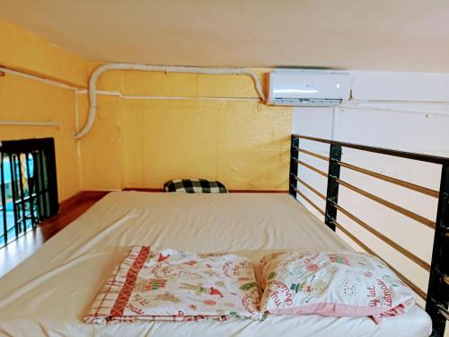 a bed in a small room with at Private Homestay 402 Lily's house 2 beds in city center in Ho Chi Minh City