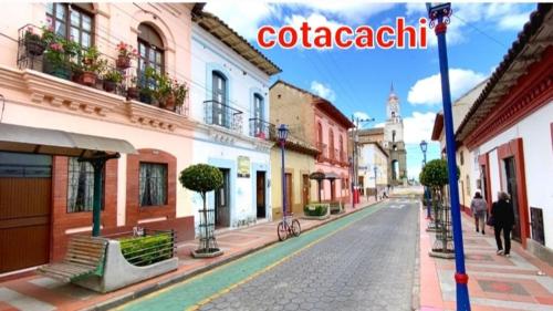 a city street with people walking down the street at Casa Apartamento Campestre en las Faldas del Tayta Imbabura in San Juan de Ilumán