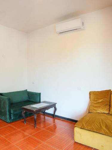 a living room with a couch and a table at Casa Mate BeachFront HOUSES El Cuyo in El Cuyo