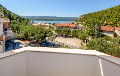 a view from a balcony of a town with a street at 1 Bedroom Awesome Apartment In Klek in Klek