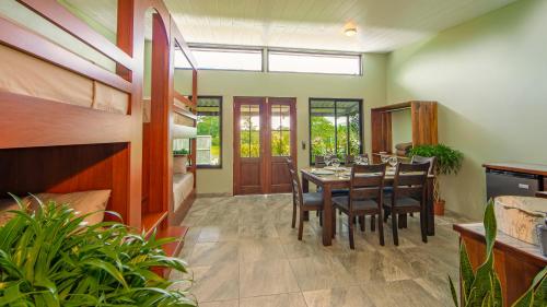 a kitchen and dining room with a table and chairs at Wellness Park CR in Fortuna