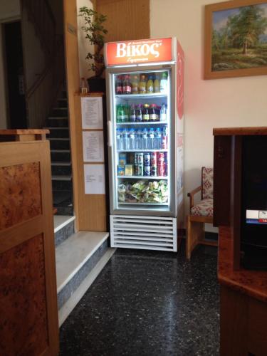 a refrigerator filled with lots of drinks in a store at Aegli Hotel in Athens