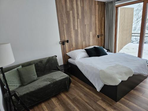 Кровать или кровати в номере Apartmán Kľak