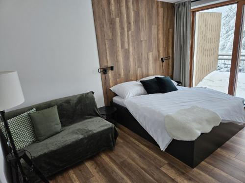 Ένα ή περισσότερα κρεβάτια σε δωμάτιο στο Apartmán Kľak