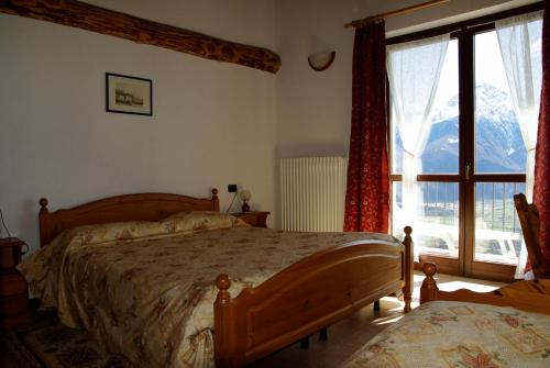 Postel nebo postele na pokoji v ubytování Hotel Tamola
