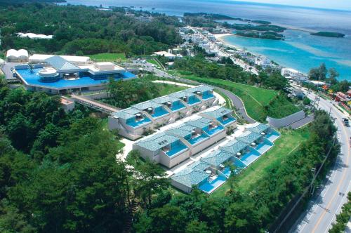 an aerial view of a building with a resort at Oriental Hills Okinawa in Onna