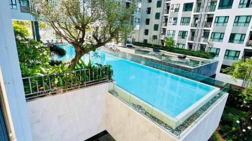 a swimming pool in the middle of a building at The base Central Pattaya 631 by Numam in Pattaya Central