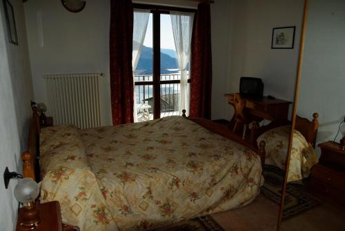 Postel nebo postele na pokoji v ubytování Hotel Tamola